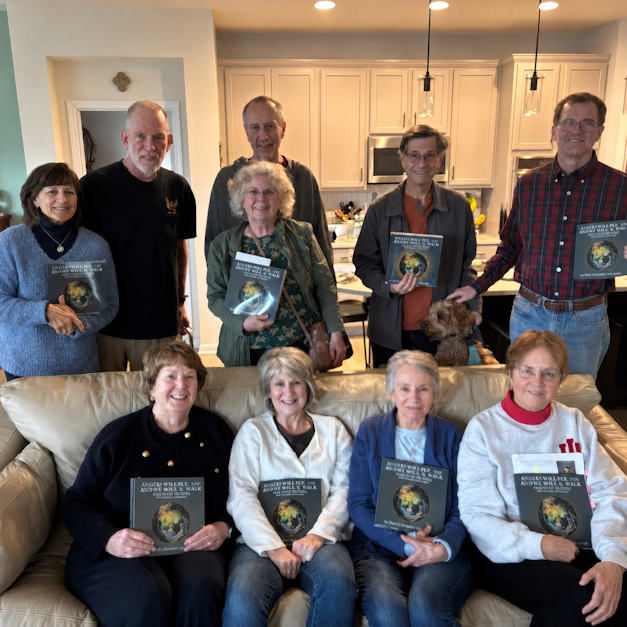 Readers holding copies of the book
